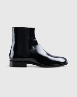 Shop Maison Margiela Leather Tabi Ankle Boot black/washed